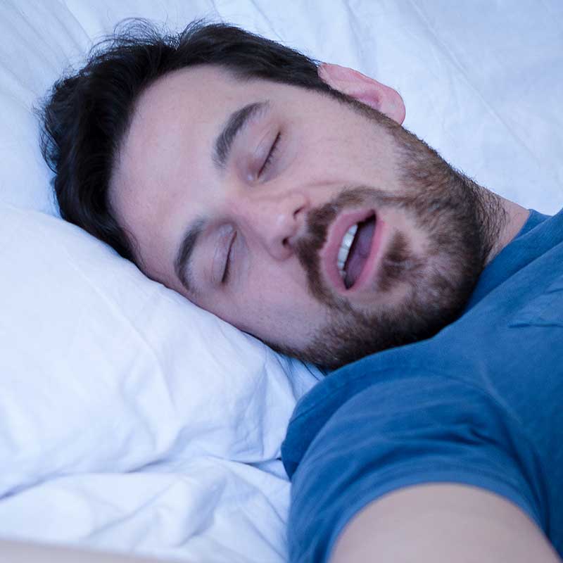 Man experiencing sleep apnea