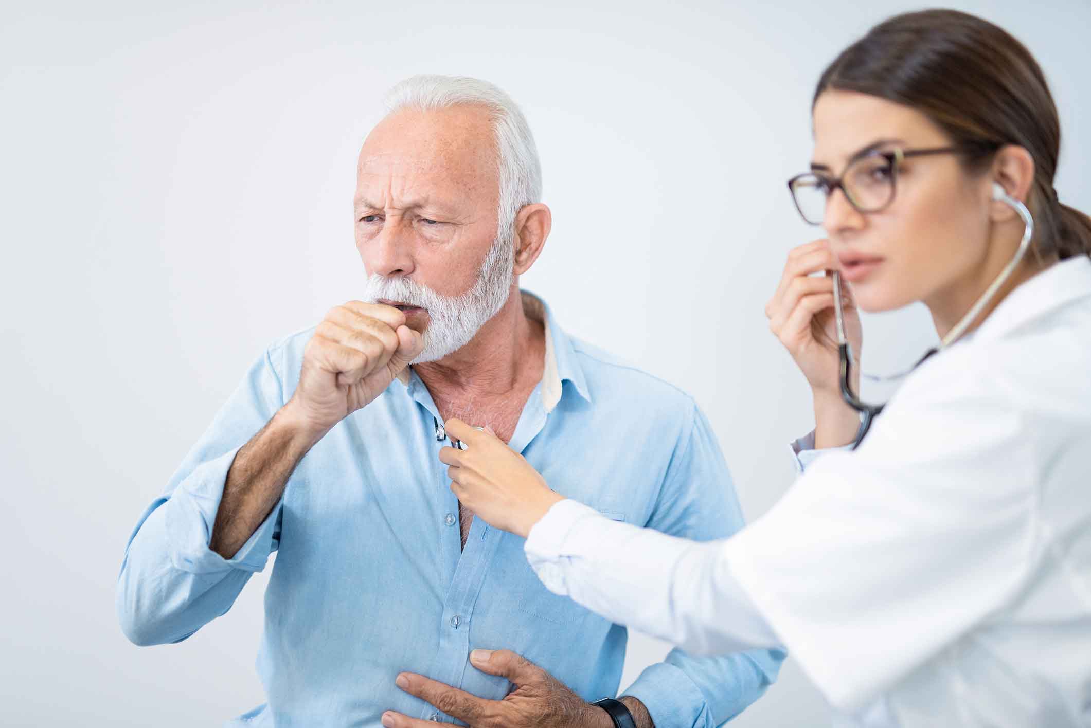Doctor listening to a patient's cough
